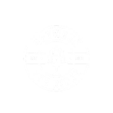 Circular logo for Between the Rinks with a central hop cone, EST 2019, on a green background.