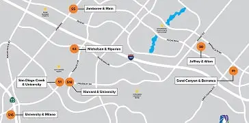 City map with orange pins marking locations and labeled streets and landmarks.