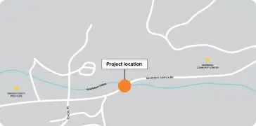Map showing project location marked by an orange circle on a street network