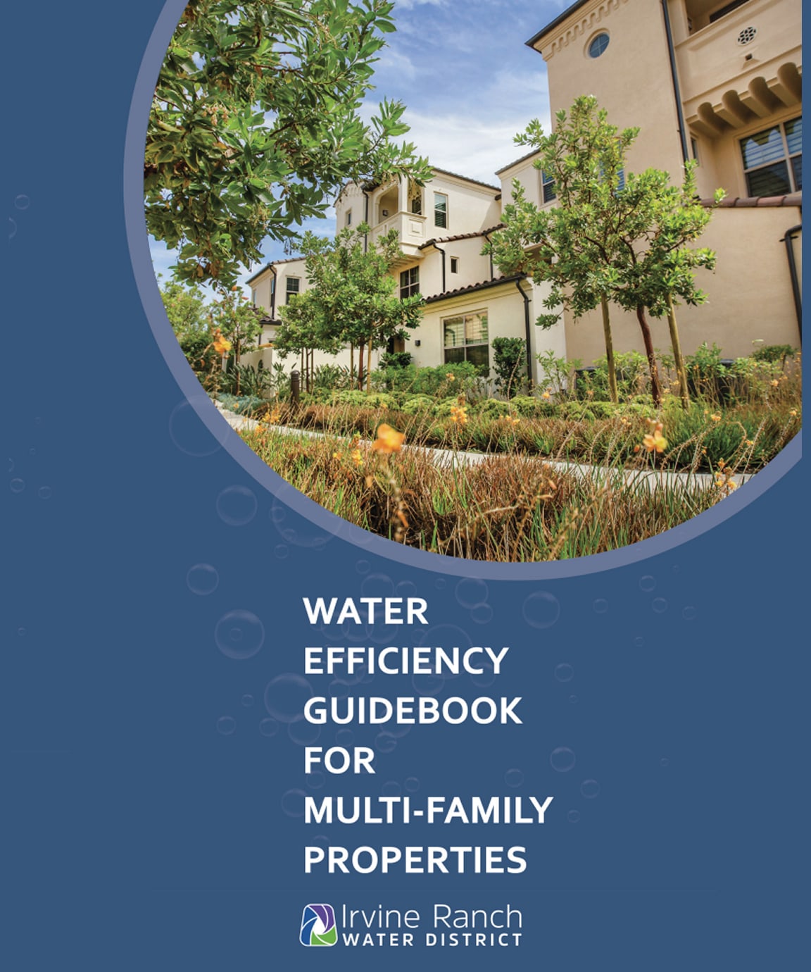 Residential housing complex with lush landscaping on the cover of a water efficiency guidebook.