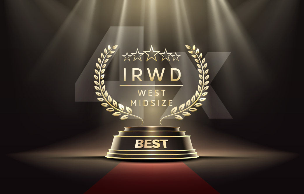 Golden award trophy on a spotlighted stage with laurel wreaths and 'BEST' on the pedestal.